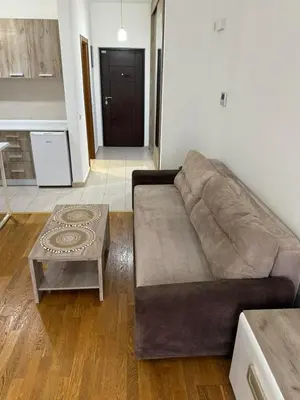 a living room with a couch and a coffee table at Studio Marovic in Ulcinj