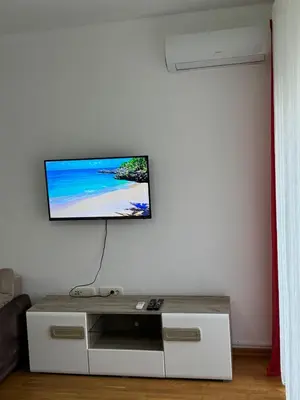a living room with a flat screen tv on a wall at Studio Marovic in Ulcinj