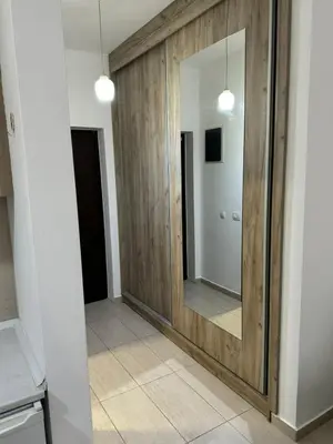 a hallway with a large mirror in a room at Studio Marovic in Ulcinj