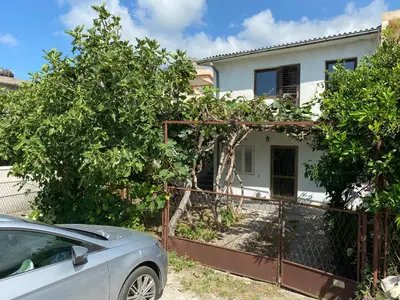 a car parked in front of a house at Deskos Cottage in Sutomore in Zgrada