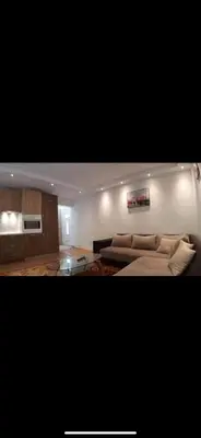 a living room with a couch and a table at Apartment Dd in Budva
