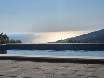a swimming pool with a view of the ocean at Villa Monza in Bar