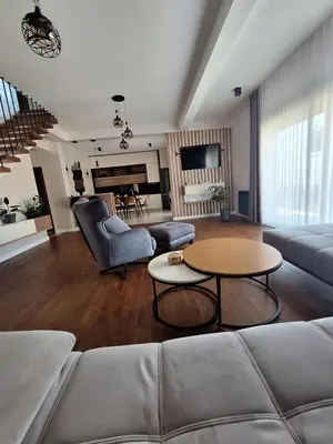 a living room with a couch and a table at Villa Bartula Lux in Rap