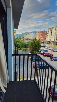 a balcony with a view of a parking lot at Podgorica apartments Planet in Podgorica
