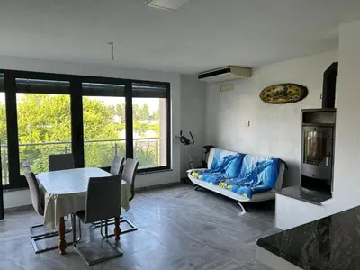 a living room with a table and a couch at Apartments David in Ulcinj
