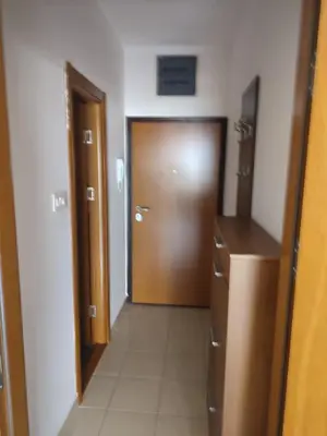 a hallway with a door and a room with a tile floor at Studio Vanja in Budva