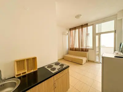 a kitchen with a sink and a counter top at Biser Apartmani in Dobra Voda