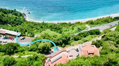 an aerial view of a house next to a beach at Budva Felix Suites in Budva
