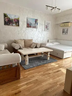 a living room with a couch and a table at Due Sorelle in Podgorica