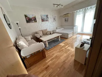 a living room with a couch and a table at Due Sorelle in Podgorica