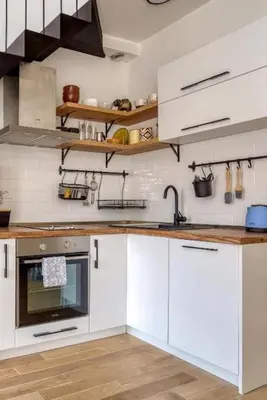 a kitchen with white cabinets and a sink at Magi-Family Rooftop Apartment Budva in Budva