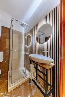 a bathroom with a sink and a shower at Olive Branch 1bd Apartment Dobra Voda in Bar