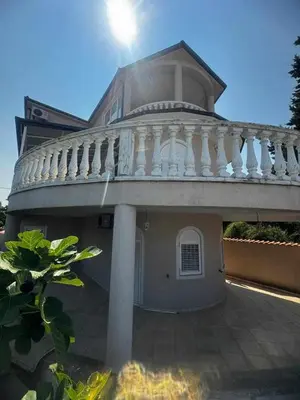 a large house with a balcony on top of it at Villa Noble in Dobra Voda