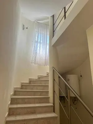 a staircase in a house with a window at Villa Noble in Dobra Voda