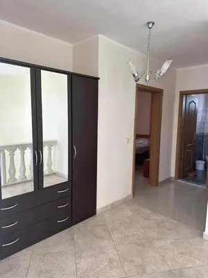 a room with a large dresser with a glass door at Villa Noble in Dobra Voda