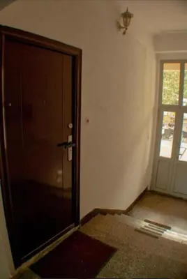 an empty room with a door to a room at Sleep & Spa 1 in Podgorica