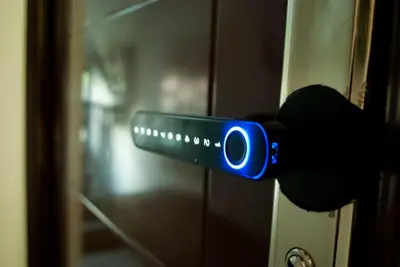 a person holding a remote control in front of a door at Sleep & Spa 1 in Podgorica