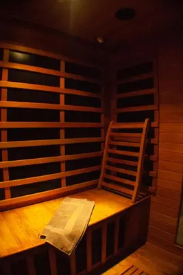 an empty stage with a chair in a room at Sleep & Spa 1 in Podgorica