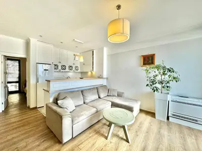 a living room with a couch and a table at Lenny One bedroom Apartment Sveti Stefan in Budva