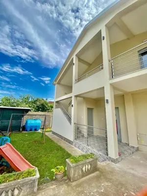 a house with a yard in front of it at Apartment Victor in Kotor