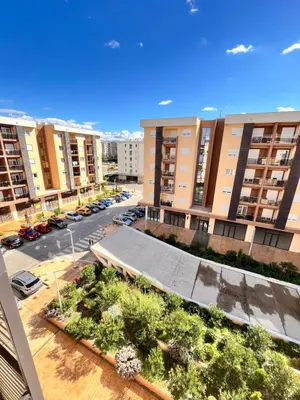 an aerial view of a parking lot with apartment buildings at New City Luxury Apartments in Podgorica