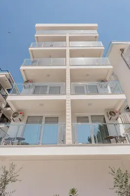 an apartment building with balconies on the side of it at Bliss Apartments in Sutomore