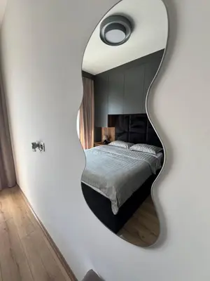 a bedroom with a large mirror on the wall at Apollo 2 in Ulcinj