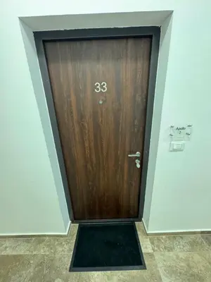 a door with the on it in a room at Apollo 2 in Ulcinj