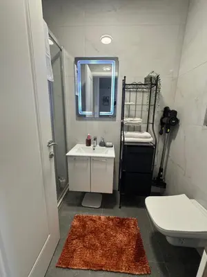 a bathroom with a sink and a toilet and a mirror at Apollo 2 in Ulcinj