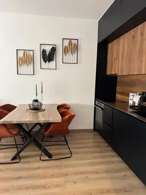 a kitchen with a table and chairs in a room at Apollo 2 in Ulcinj