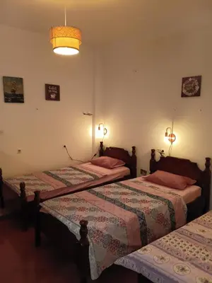 a bedroom with two beds and a light at Hostel Flash in Ulcinj