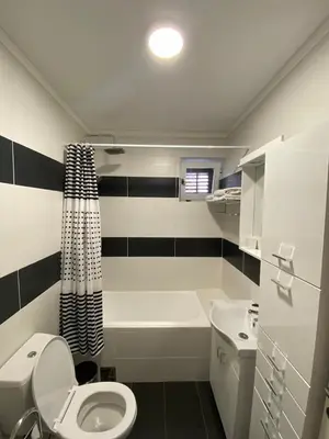 a bathroom with a toilet and a tub and a sink at Comfort studio Lepa Kata in Podgorica