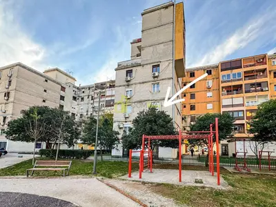 a playground in front of a large building at Comfort studio Lepa Kata in Podgorica