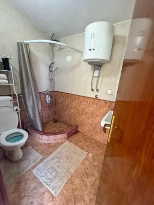 a bathroom with a shower and a toilet at Apartment Melody in Kotor