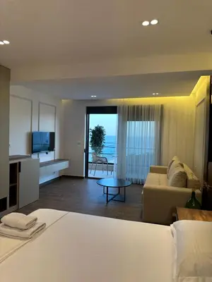 a living room with a couch and a table at Villa Marmo in Ulcinj