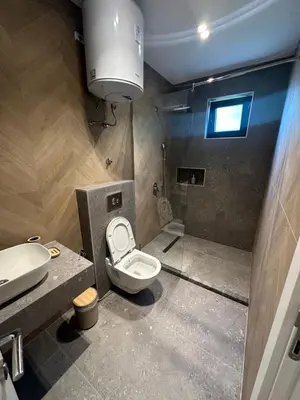 a bathroom with a toilet and a sink at Villa Marmo in Ulcinj