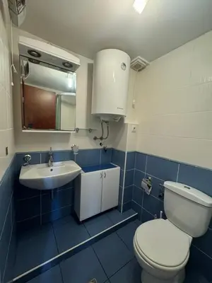 a bathroom with a toilet and a sink at Budva Center Studio in Budva