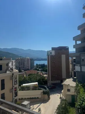 a view of a city with buildings and a body of water at Budva Center Studio in Budva
