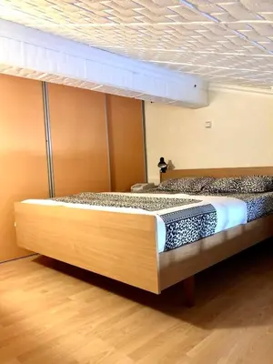 a large bed in a room with at Loft apartment Kapisoda in Budva