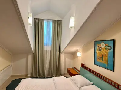 a hotel room with a bed and a window at Central 25 in Podgorica
