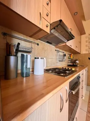 a kitchen with a wooden counter top with a stove at Apartment Marron Matou Budva in Budva