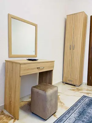 a desk with a mirror and a ottoman in a room at Karadag in Ulcinj