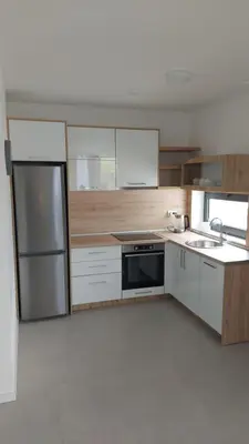 a kitchen with a sink and a stove and refrigerator at Casa Aurelia in Gornji Štoj