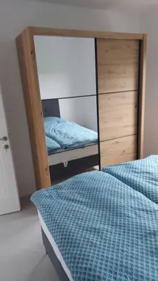 a room with two bunk beds and a mirror at Casa Aurelia in Gornji Štoj