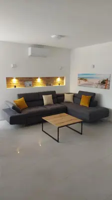 a living room with a couch and a coffee table at Casa Aurelia in Gornji Štoj