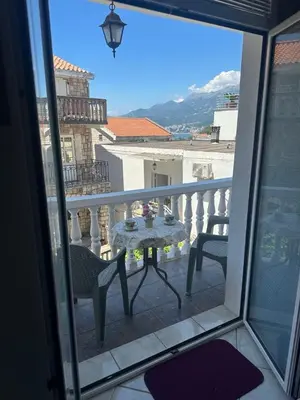 a view of a balcony with a table and chairs at TIA Sveti Stefan in Budva