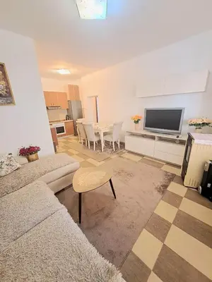a living room with a couch and a table at N&B Apartment Kotor in Kotor