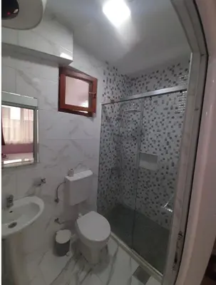 a bathroom with a shower and a toilet and a sink at Riian Luxury Apartments in Ulcinj