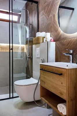 a bathroom with a toilet and a sink and a shower at Riian Luxury Apartments in Ulcinj