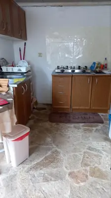 a kitchen with a sink and a counter top at Milica, Soba sa kupatilom in Petrovac na Moru